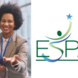 Image of a woman at a convention center with her hand outstretched to the viewer.