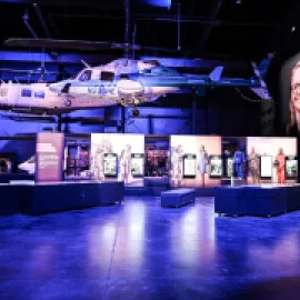Photo of two suspended military helicopters in an exhibit space at the Sullenberger Aviation Museum.