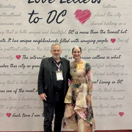 Senior Contributor Jeff Heilman and Melissa A. Riley, SVP of convention sales and services for Destination DC at Love Letter wall at IMEX.