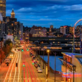 Image of the Seattle waterfront at night.