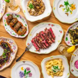 Assorted food dishes laid out on a table next to each other.