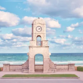 Worth Avenue Clock Tower, with the ocean in the background.