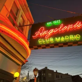  Angeloni's Club Madrid exterior with neon sign.