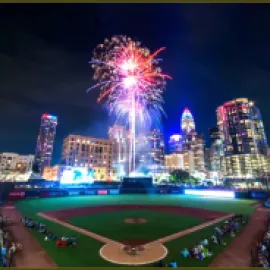 Truist Field, with fireworks and the skyline of Charlotte, North Carolina, in the background.