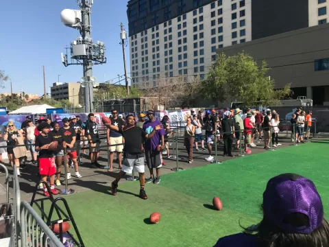NFL Draft Experience participant throwing a football