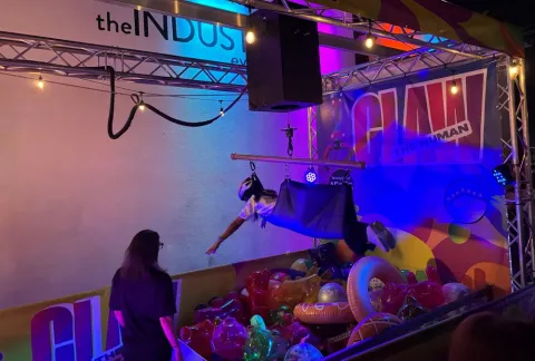 For even more adventurous folks, the “human claw” game at Site Nite had them reaching down to grab swag while a partner moved them around using a joystick.