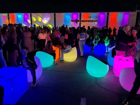 Site Nite’s outdoor area at The Industrial event space included seating with a cool fluorescent glow.