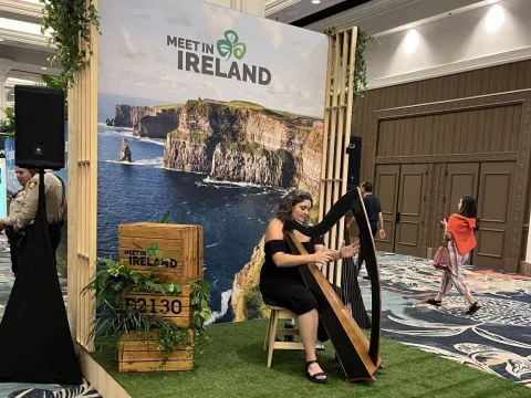 Tourism Ireland activation included a harpist at IMEX America.