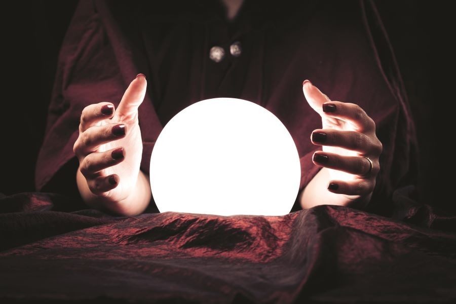 Image of fortune teller and crystal ball.