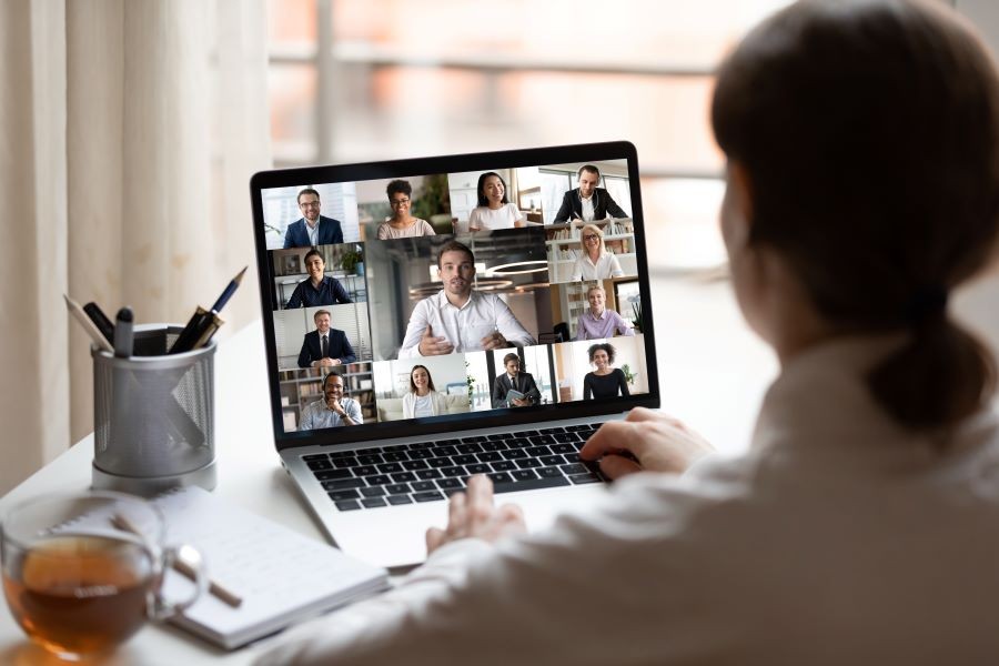 Woman sitting in front of laptop.