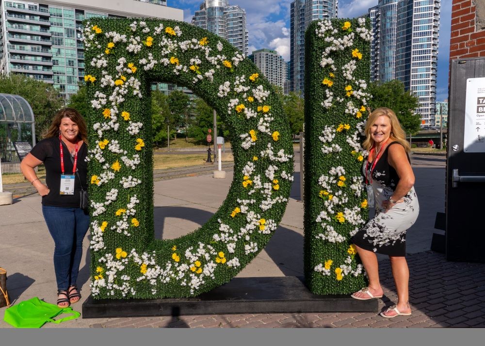 Attendees pose outside of Steam Whistle Complex during Destinations International's Annual Convention in Toronto