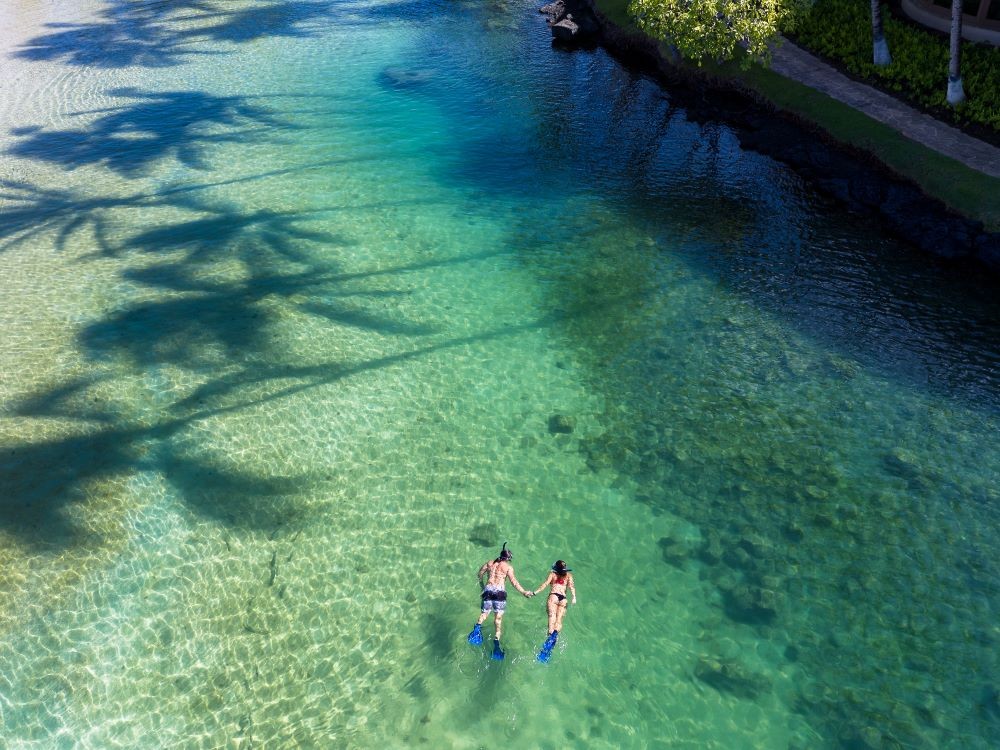 Snorkelers in a lagoon. Credit - Hilton Waikoloa Village