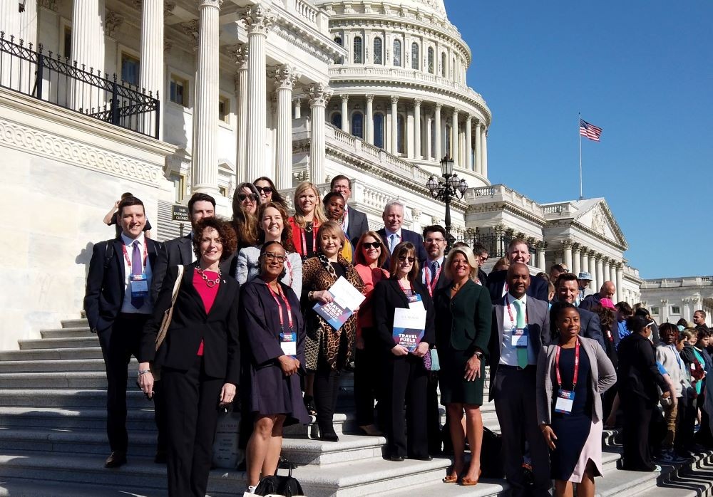 Photo of U.S. travel industry leaders on the steps of the U.S. Capitol.