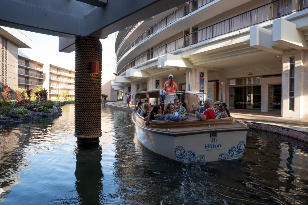 Planners taking a boat tour of Hilton Waikoloa Village