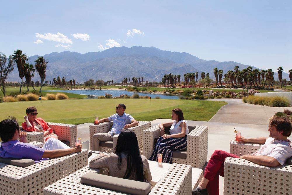 Group of attendees meeting outside in Palm Springs