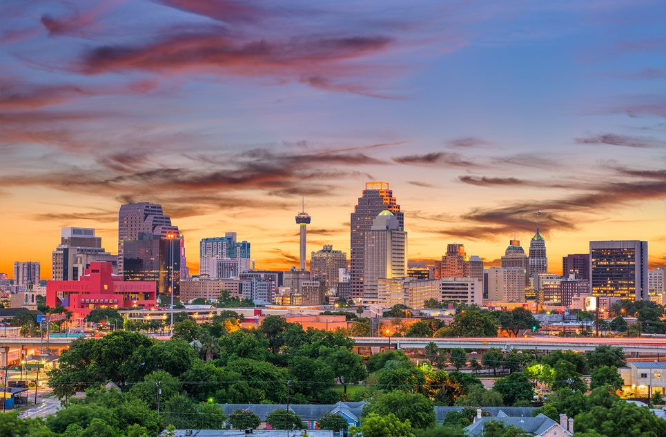 Photo of San Antonio skyline at dusk.