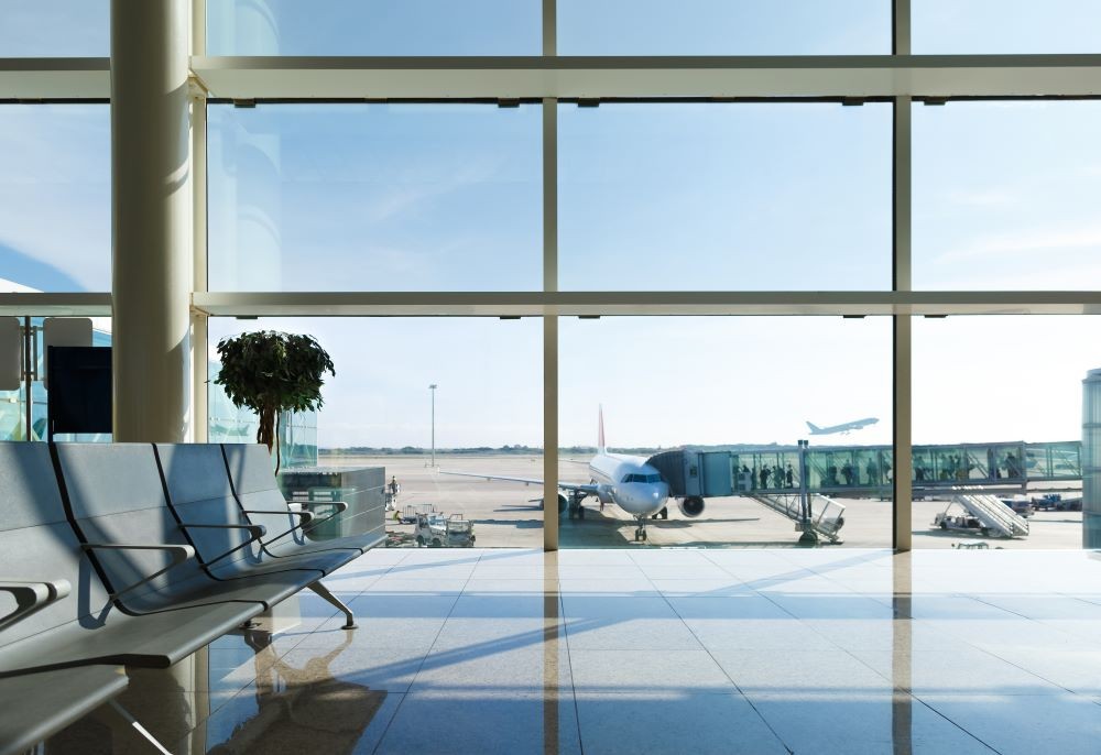 View of planes from the window of the gate area at an airport