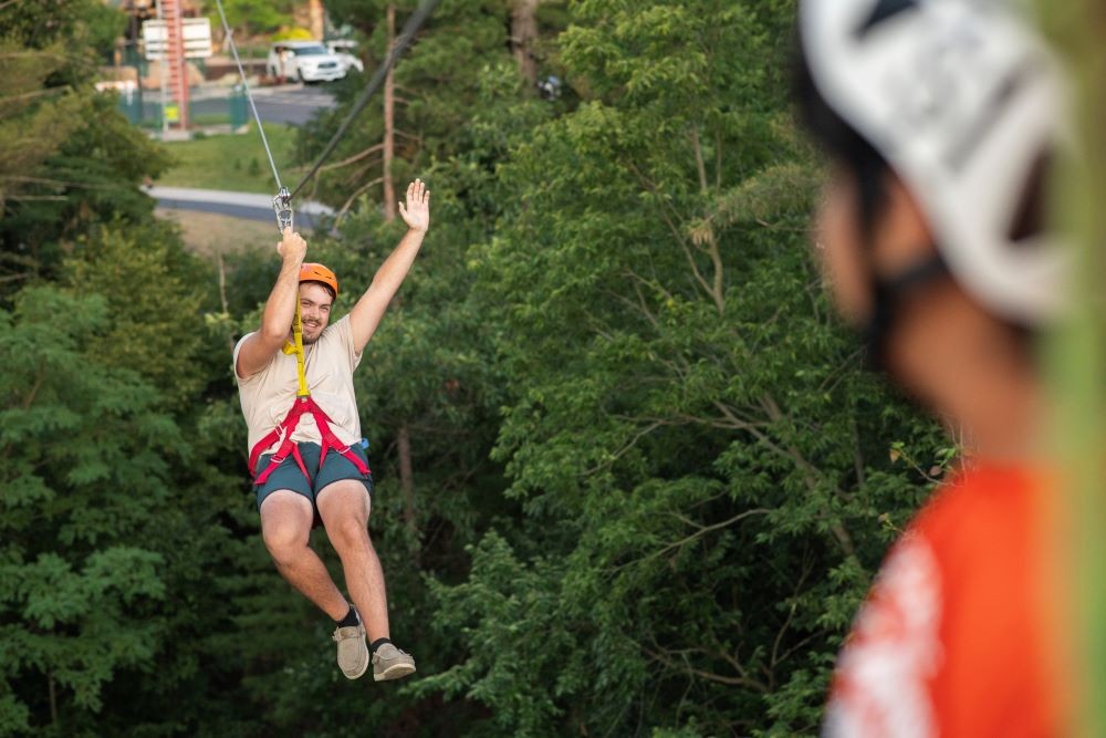 Photo of man ziplining at Wilderness Resort, Wisconsin Dells, Wisconsin.