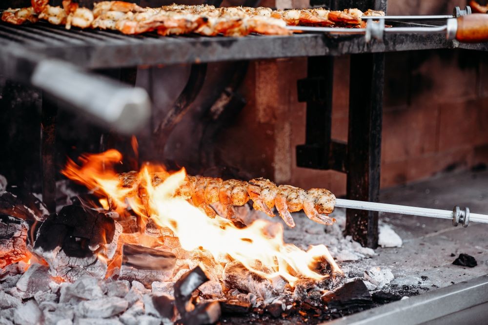 Shrimp cooking over an open fire grill at Meetings Today LIVE! West in Palm Springs