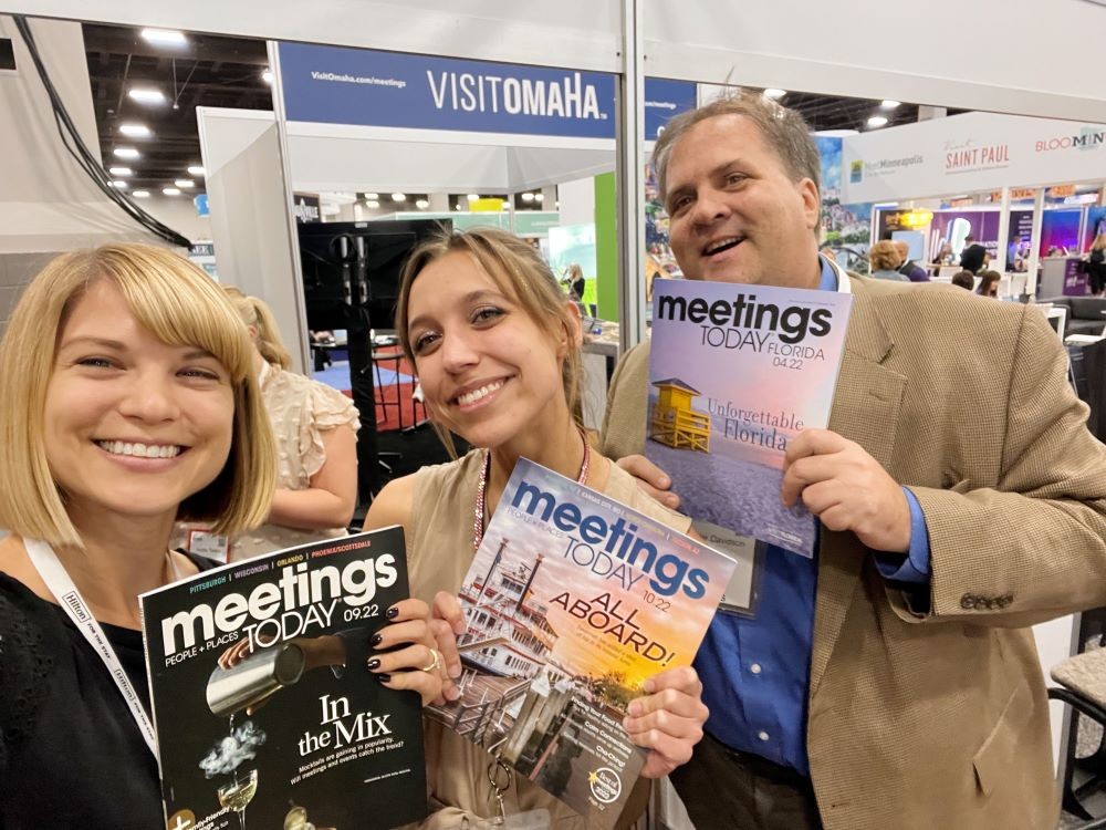 Photo of Meetings Today editors at booth at 2022 IMEX America.