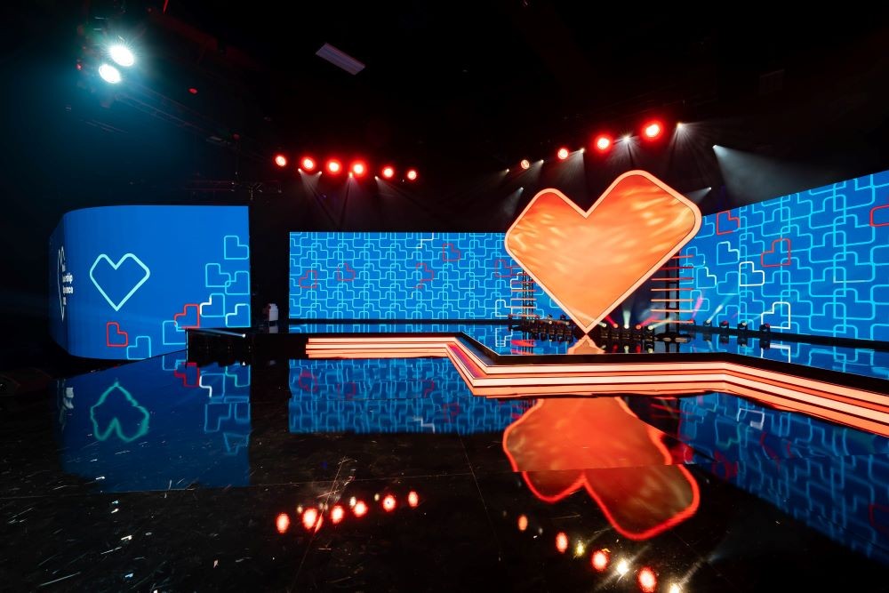 Image of CVS Health's Retail Leadership Experience Event, with a heart on a stage.