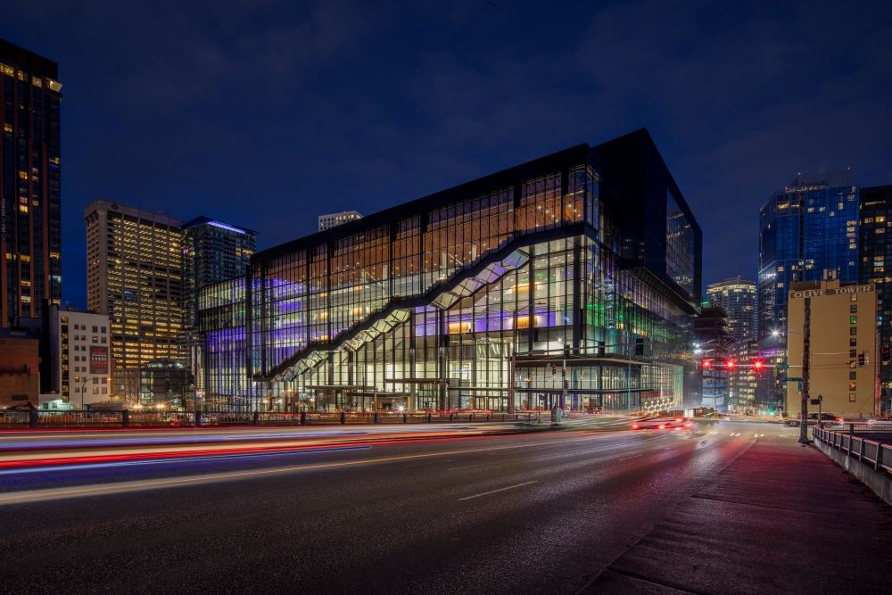 Photo of exterior of Seattle Convention Center Summit building at night.