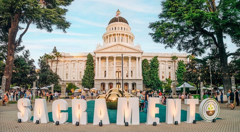 Event behind Sacramento sign