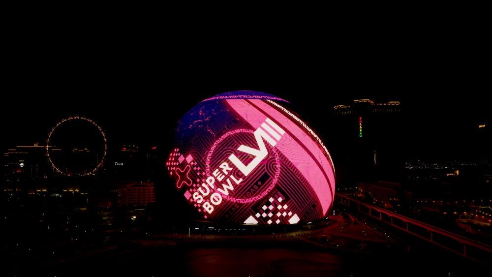 Super Bowl ad on the Sphere exterior in Las Vegas at nighttime