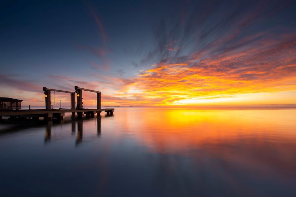 Photo of a sunset and a pier in South Padre Island, Texas.