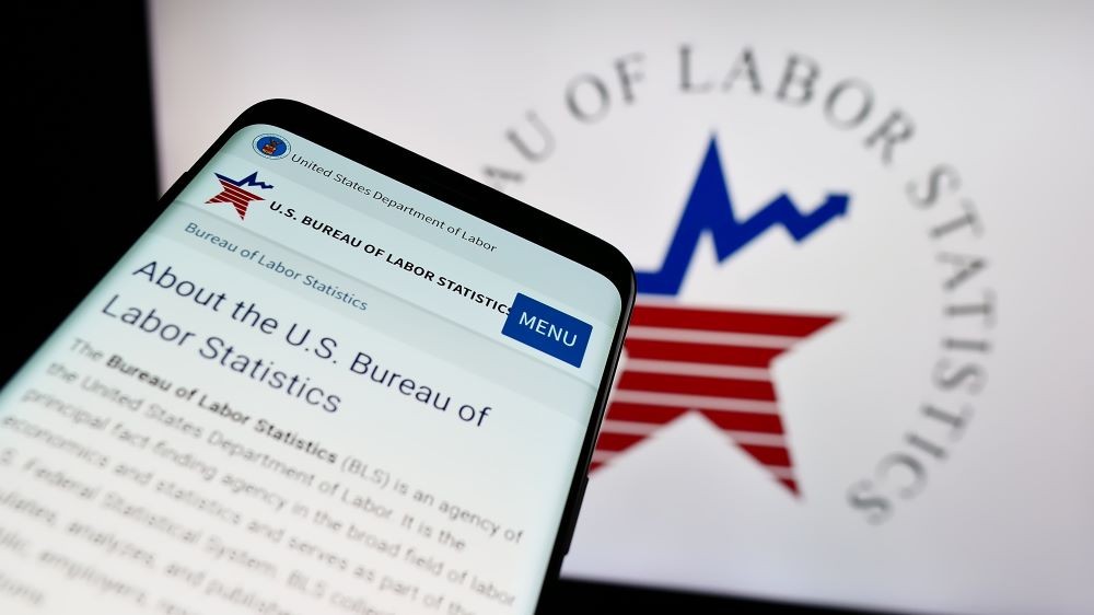 Graphic of U.S. Labor Statistics logo on cell phone and computer screen.