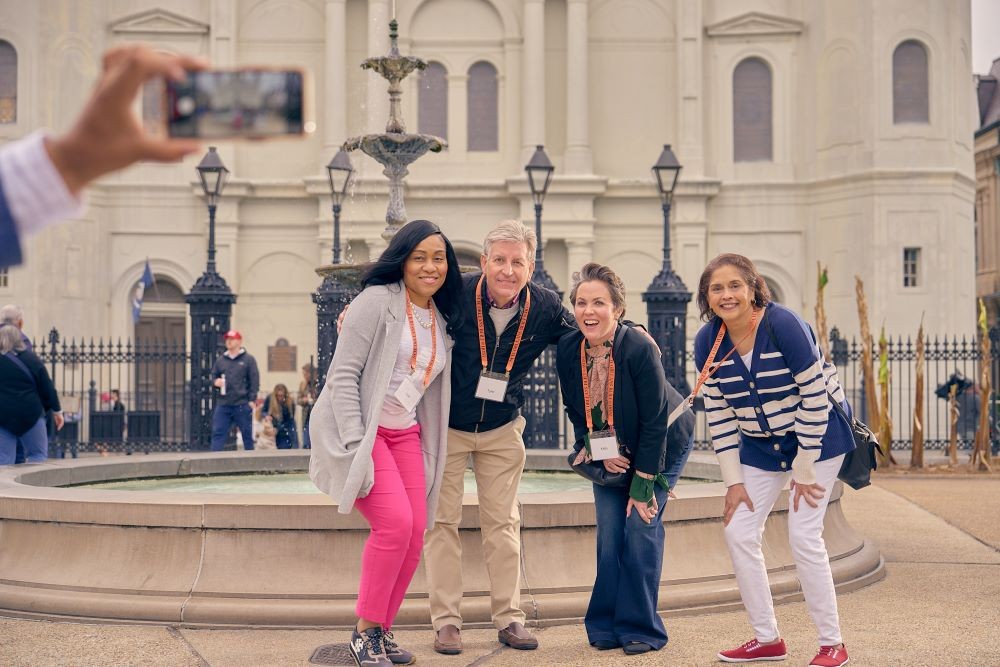 Group of meeting attendees pose for a photo in New Orleans