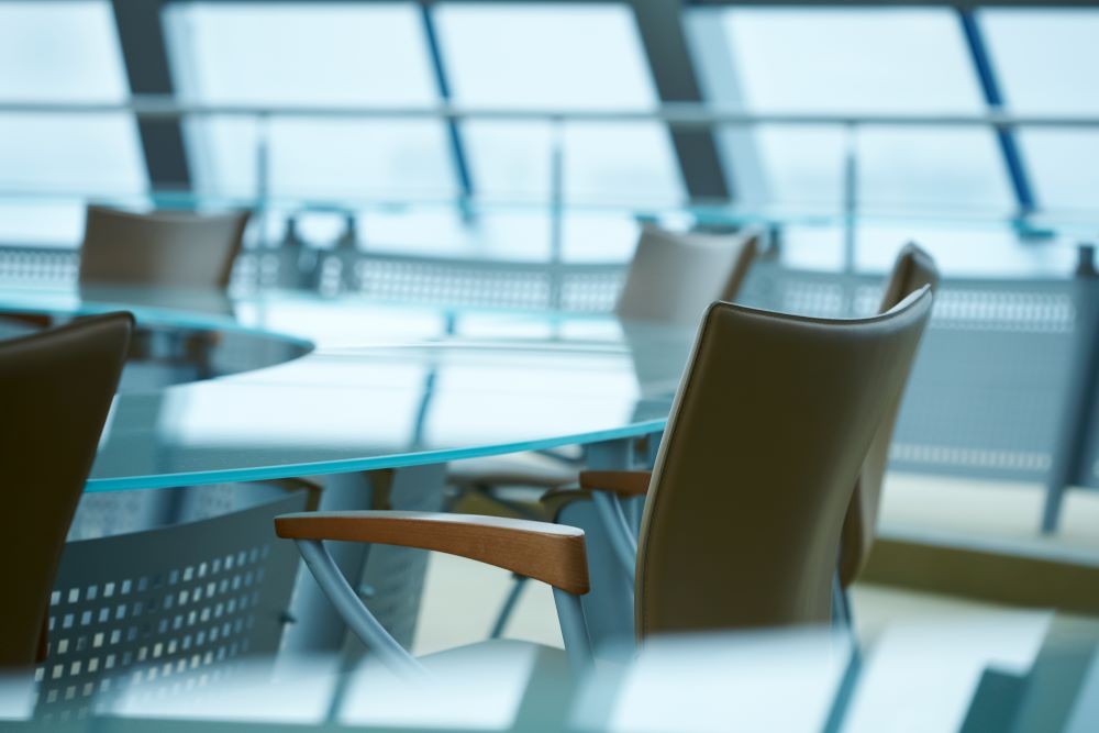 Modern conference room with windows and a glass table