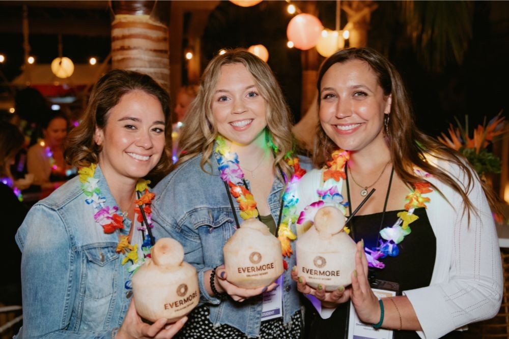 Group Holding Evermore-Branded Coconuts at Opening Reception