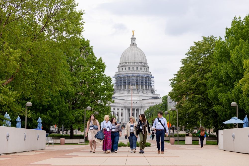 Attendees walking in front of Wisconsin State Capitol