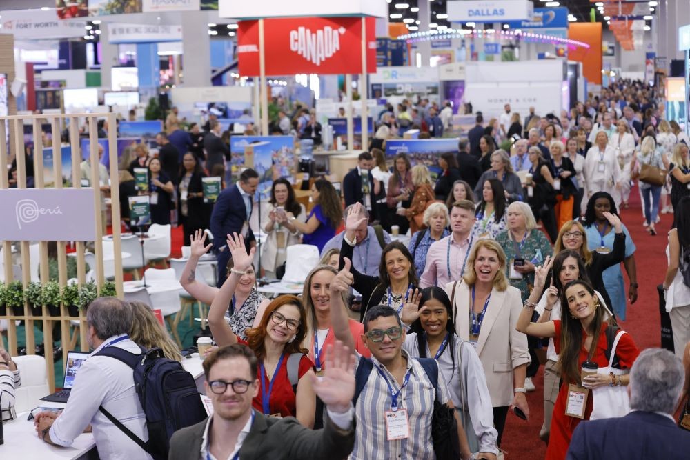 Group of attendees on exhibit floor at IMEX America 2024.