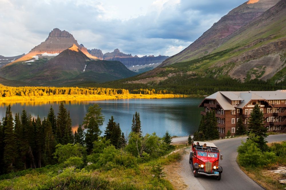 Red bus tour in Glacier National Park’s Many Glacier Valley.