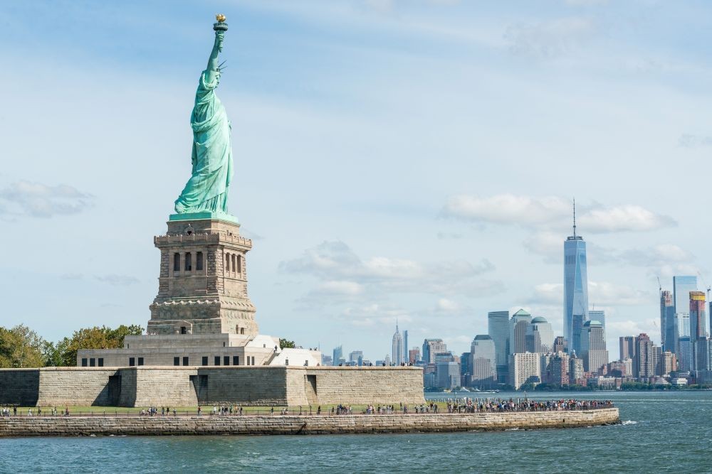 Statue of Liberty and New York City skyline. Credit: Julienne Schaer for NYC Tourism + Conventions.