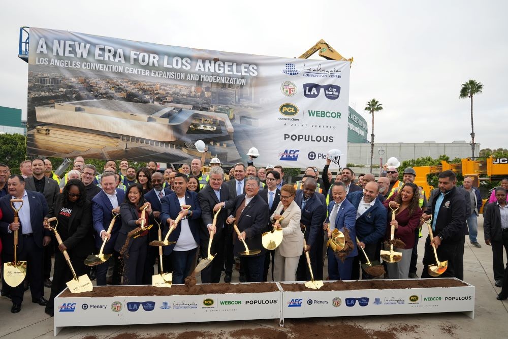 officials hold shovels at groundbreaking ceremony