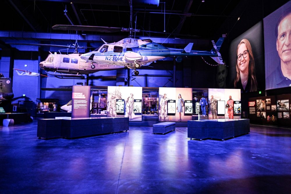 Photo of two suspended military helicopters in an exhibit space at the Sullenberger Aviation Museum.