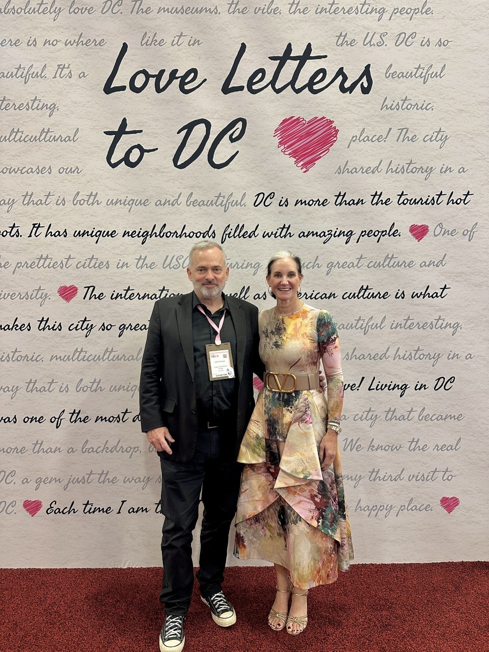 Senior Contributor Jeff Heilman and Melissa A. Riley, SVP of convention sales and services for Destination DC at Love Letter wall at IMEX.