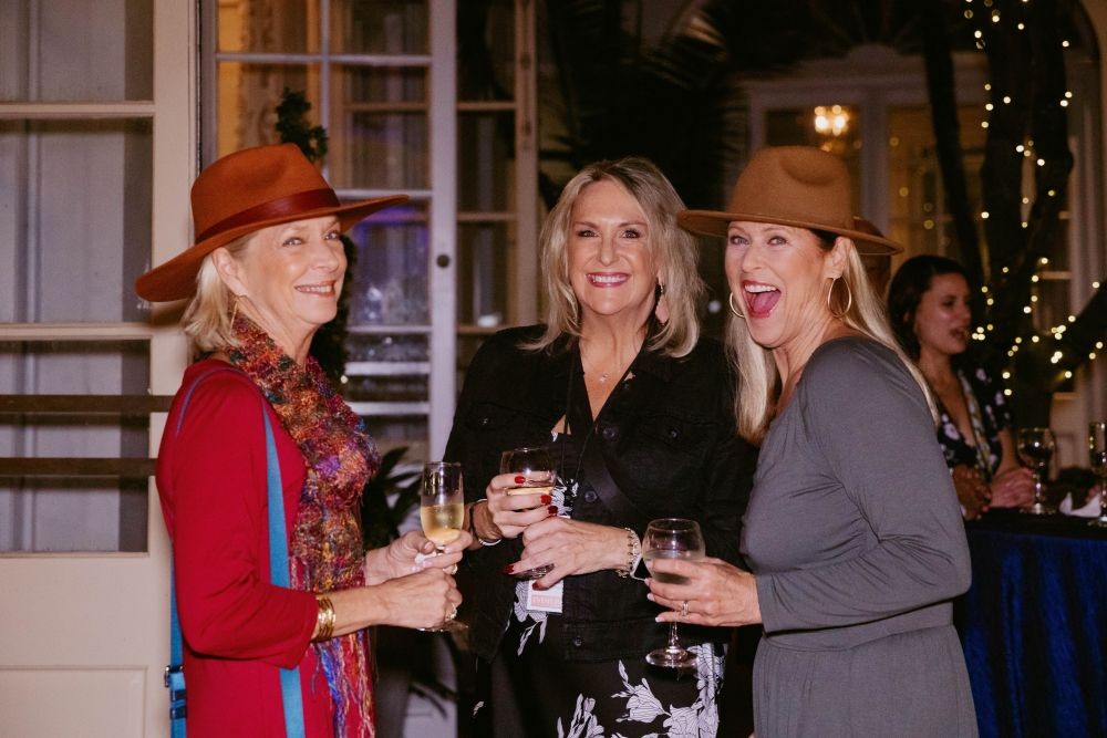 Attendees mingle with speaker, Deborah Gardner. 