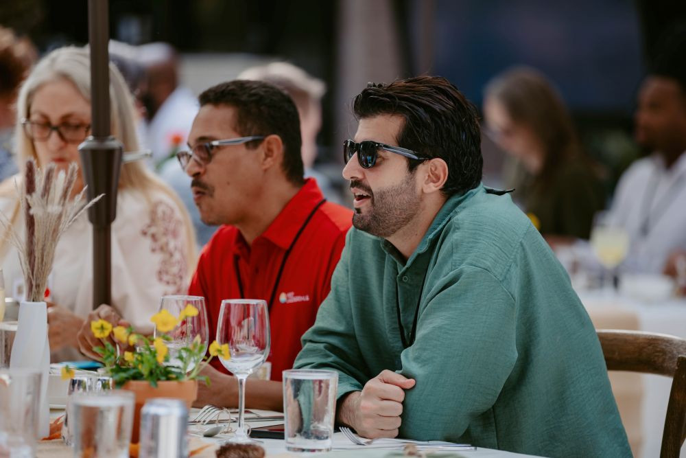 Attendees enjoy lunch on the pool deck at the Hyatt Regency New Orleans.