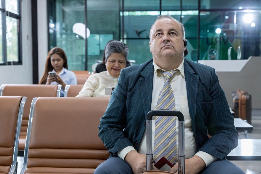 man sitting at airport