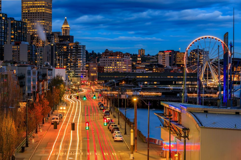 Image of the Seattle waterfront at night.