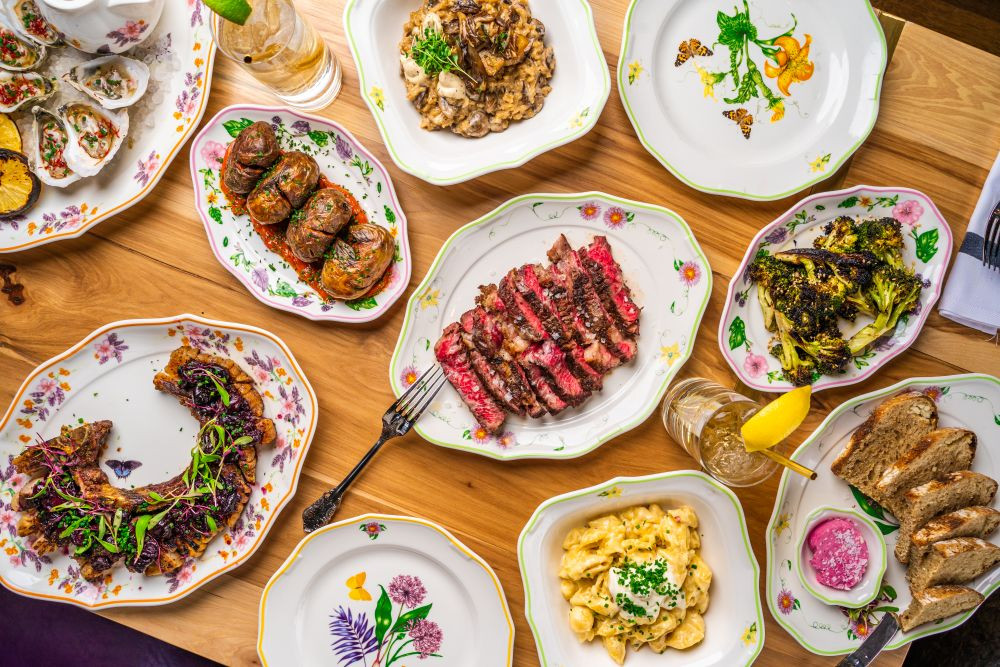 Assorted food dishes laid out on a table next to each other.