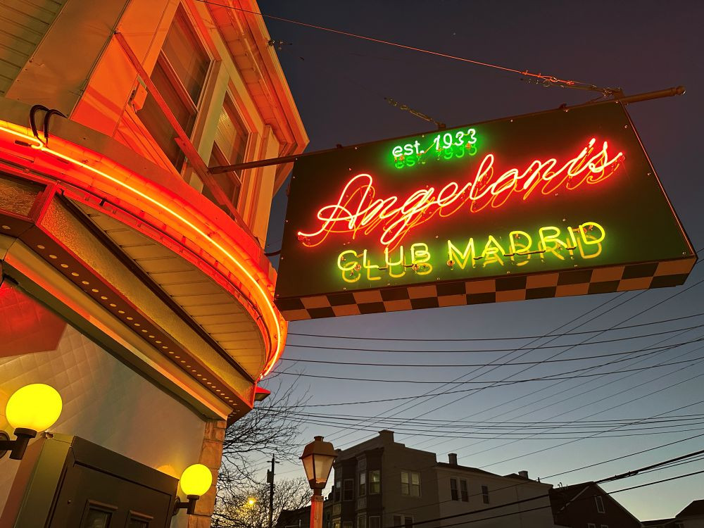  Angeloni's Club Madrid exterior with neon sign.