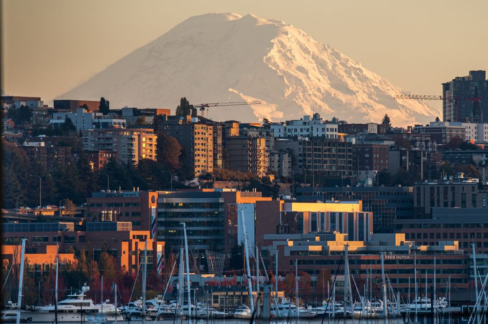 Skyline of Seattle from the waterfront, with Mt. Rainier in the background.