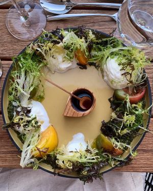 Burrata with pistachio pesto, heirloom tomatoes and compressed greens at Parkestry Rooftop Bar.