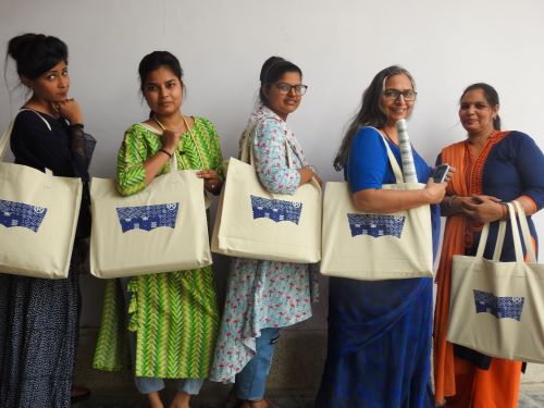 Women Pose With Levi's Tote Bags Made In Partnership With Peace By Piece International