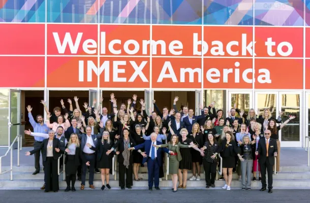IMEX America staff welcoming attendees.